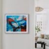 Blue and red Alonso Durán abstract print, hanging on a white wall in a contemporary living space.