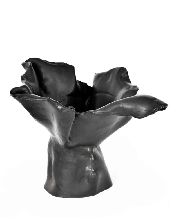 From the "Black Magnolia" series, a black ceramic vase with an organic form, ruffled magnolia-like rim, and glossy sculptural finish. , an original work available at MÍRAME Fine Art.