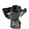 A striking ceramic from the "Black Magnolia" series, this abstract bloom showcases wavy edges and a glossy, organic elegance. , an original work available at MÍRAME Fine Art.