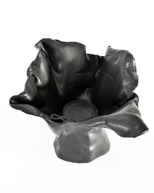 Part of the "Black Magnolia" series, this black ceramic bowl evokes a blooming flower with wavy edges and a sculpted, organic form. , an original work available at MÍRAME Fine Art.