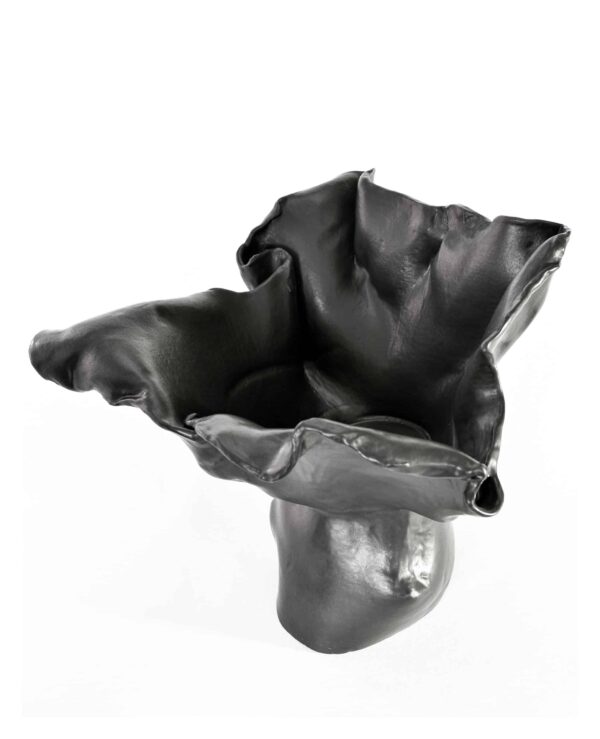 Part of the "Black Magnolia" series, this glossy black ceramic vase evokes a blooming flower with its ruffled, sculptural rim. , an original work available at MÍRAME Fine Art.