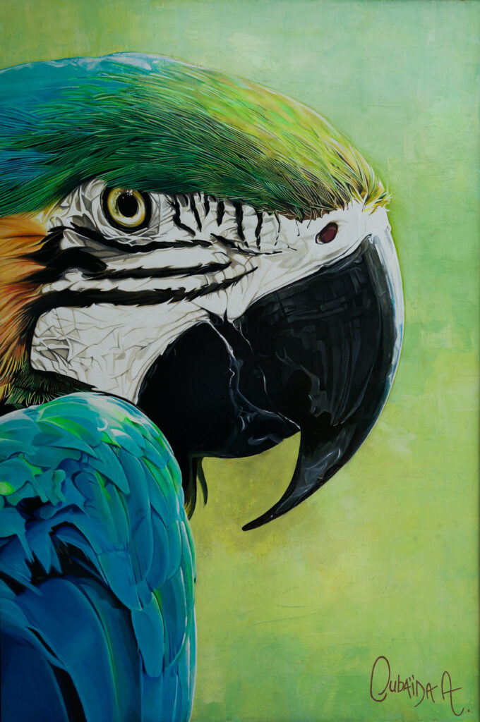 Costa Rica art scene integration. Green painting of a blue macaw by Oudaïda Azzouz, which focuses on the details in the parrot's face. The green background is abstract, complimenting the tones of the parrot's feathers.