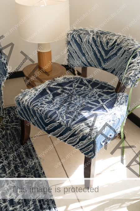 Upholstery on denim chair by the Costa Rican fashion designer Oscar Ruiz-Schmidt.