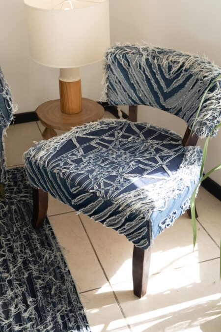 Upholstery on denim chair by the Costa Rican fashion designer Oscar Ruiz-Schmidt.