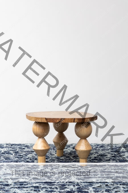 Teak and melina wood side table by the Costa Rican fashion designer, Oscar Ruiz-Schmidt.