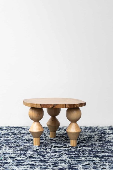 Teak and melina wood side table by the Costa Rican fashion designer, Oscar Ruiz-Schmidt.