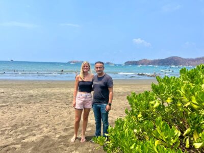 Photograph of Belinda Seppings and wildlife photographer Edwar Herreno on Playas del Coco beach, Costa Rica