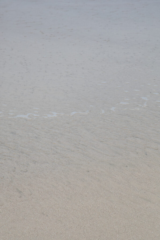 abstract ocean photography of sand under ocean water, by Juan Tribaldos.