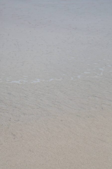 abstract ocean photography of sand under ocean water, by Juan Tribaldos.
