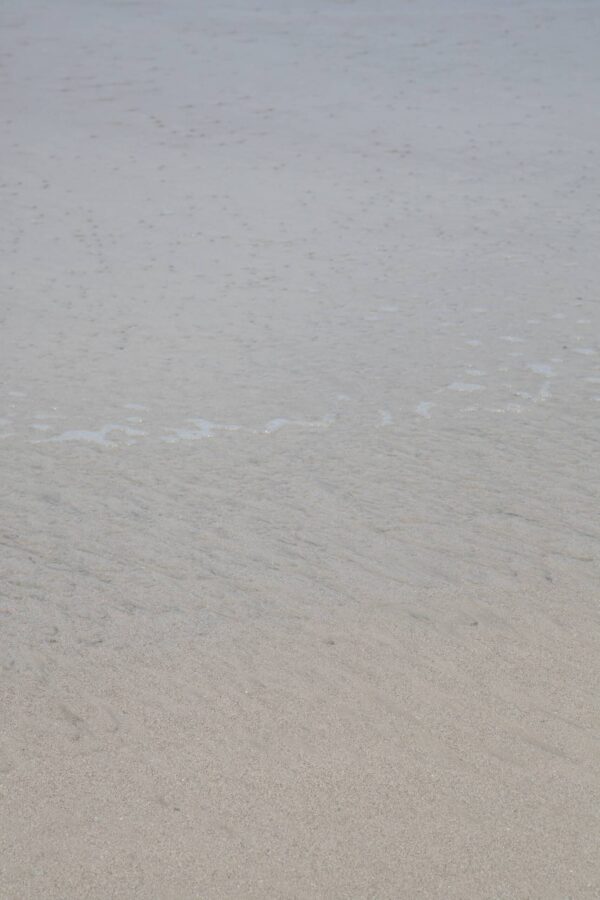 abstract ocean photography of sand under ocean water, by Juan Tribaldos.