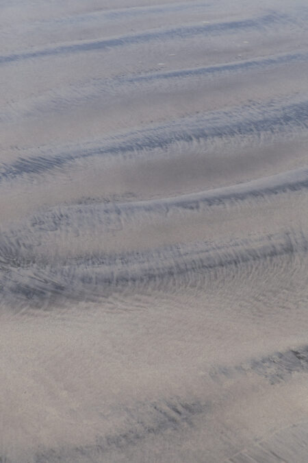 Abstract sand photography by Juan Tribaldos, depicting soft undulations that resemble streaks across a canvas.