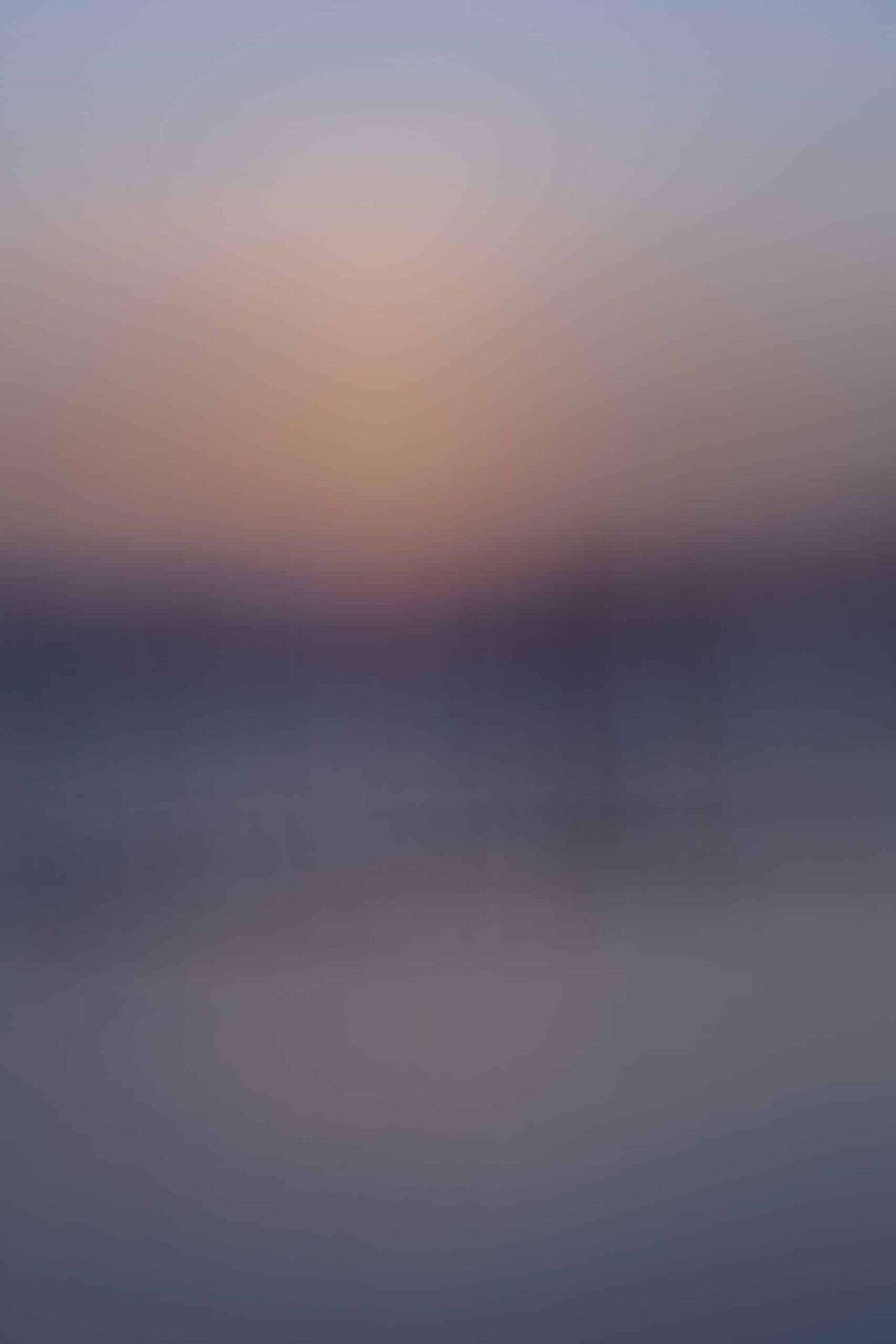 Costa Rica abstract photography by Juan Tribaldos where he has blurred the image of an ocean and soft light of either a sunrise or a sunset into complete dreamy abstraction.