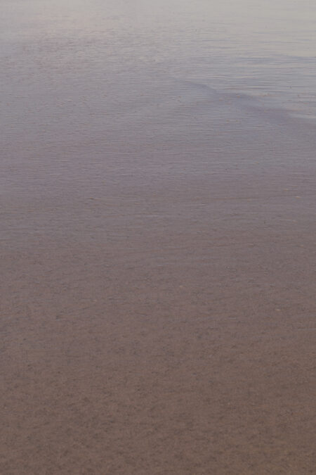 ocean texture photography by Juan Tribaldos. Blue and bronze colours capture the surface of the ocean.