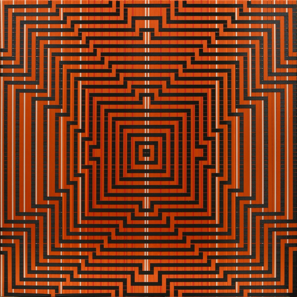 On at the Museum of Contemporary Art and Design. Orange and black geometric work produced with woven ribbon, by Katrin Aason.