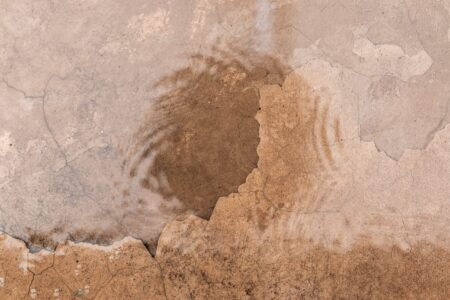abstract urban photography, featuring the cracked concrete of a city street.