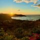 Sunset fading behind a mountain overlooking Playas del Coco bay. the image is used in an article about the Costa Rican economic growth and why so many people are investing in the country.