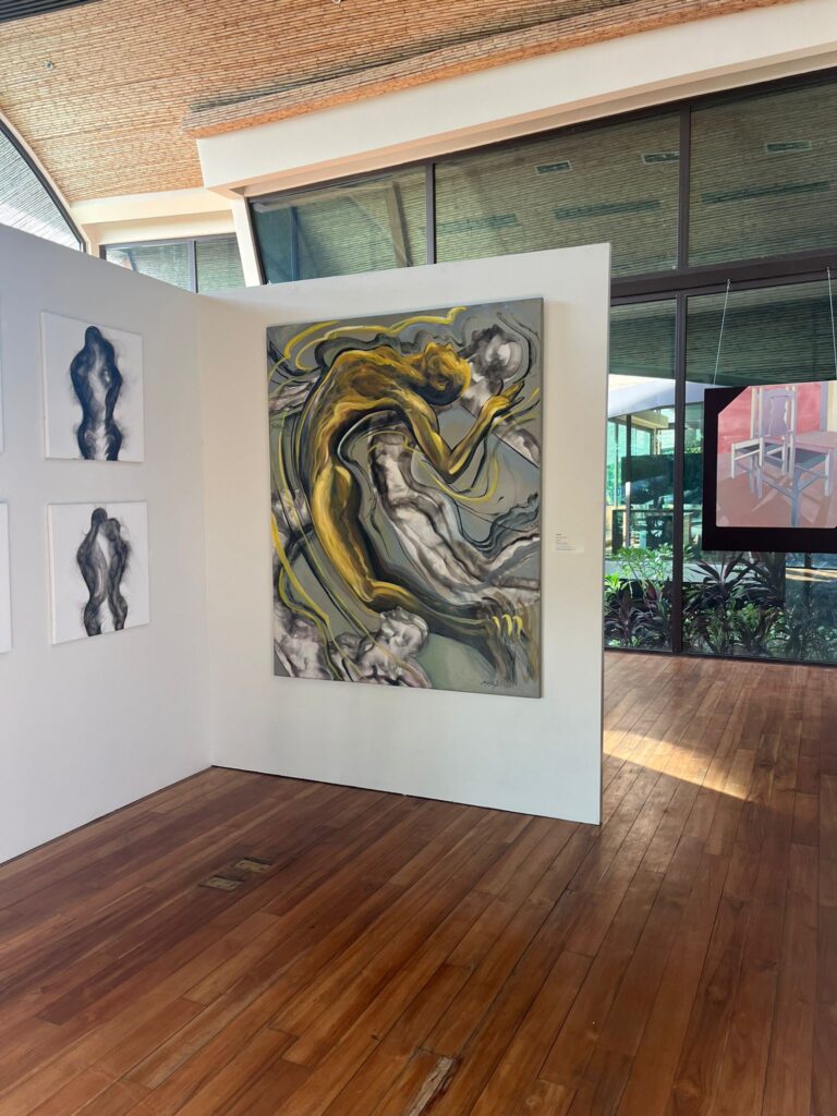 Within an elegant gallery of wooden floors, Andaz Art’s abstract figures grace white walls; sunlight illuminates a striking gray and yellow form. , an original work available at MÍRAME Fine Art.