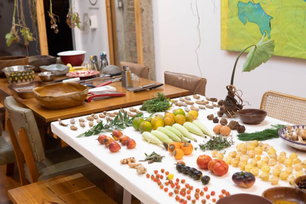 Colourful fruit and vegetables laid out on a table, as part of a Latin American art exhibition in San José, Costa Rica
