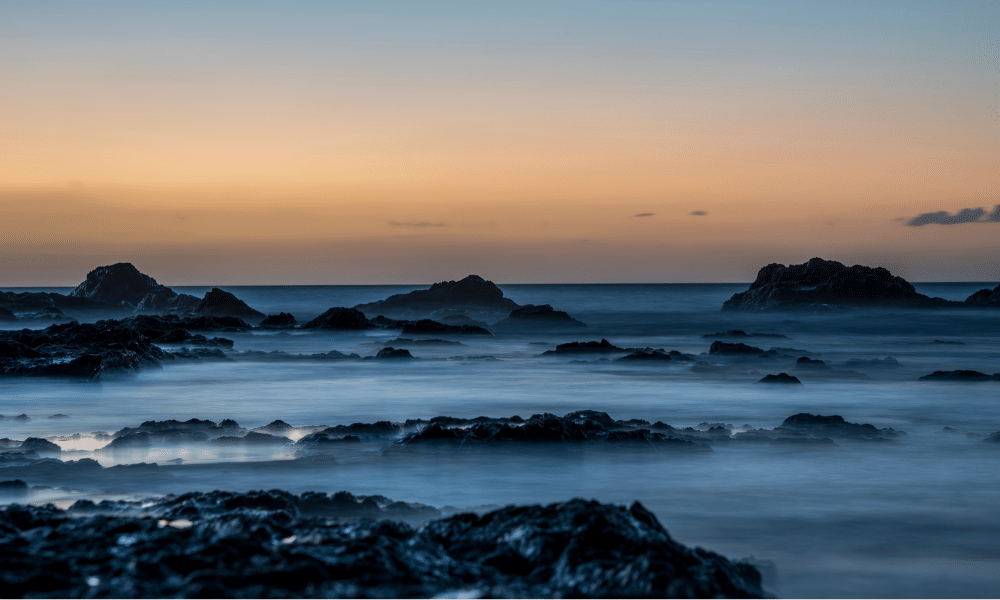 Photographu of a misty ocean sunrise on the pacific coast. Costa Rica photography by Julio Sequeira.