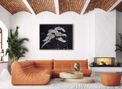 A curated modern salon: vaulted brick ceiling, orange tufted sofa, one of Carlos Fernández's abstract black soil paintings overhead; natural light illuminates from the left. An original work available at MÍRAME Fine Art.