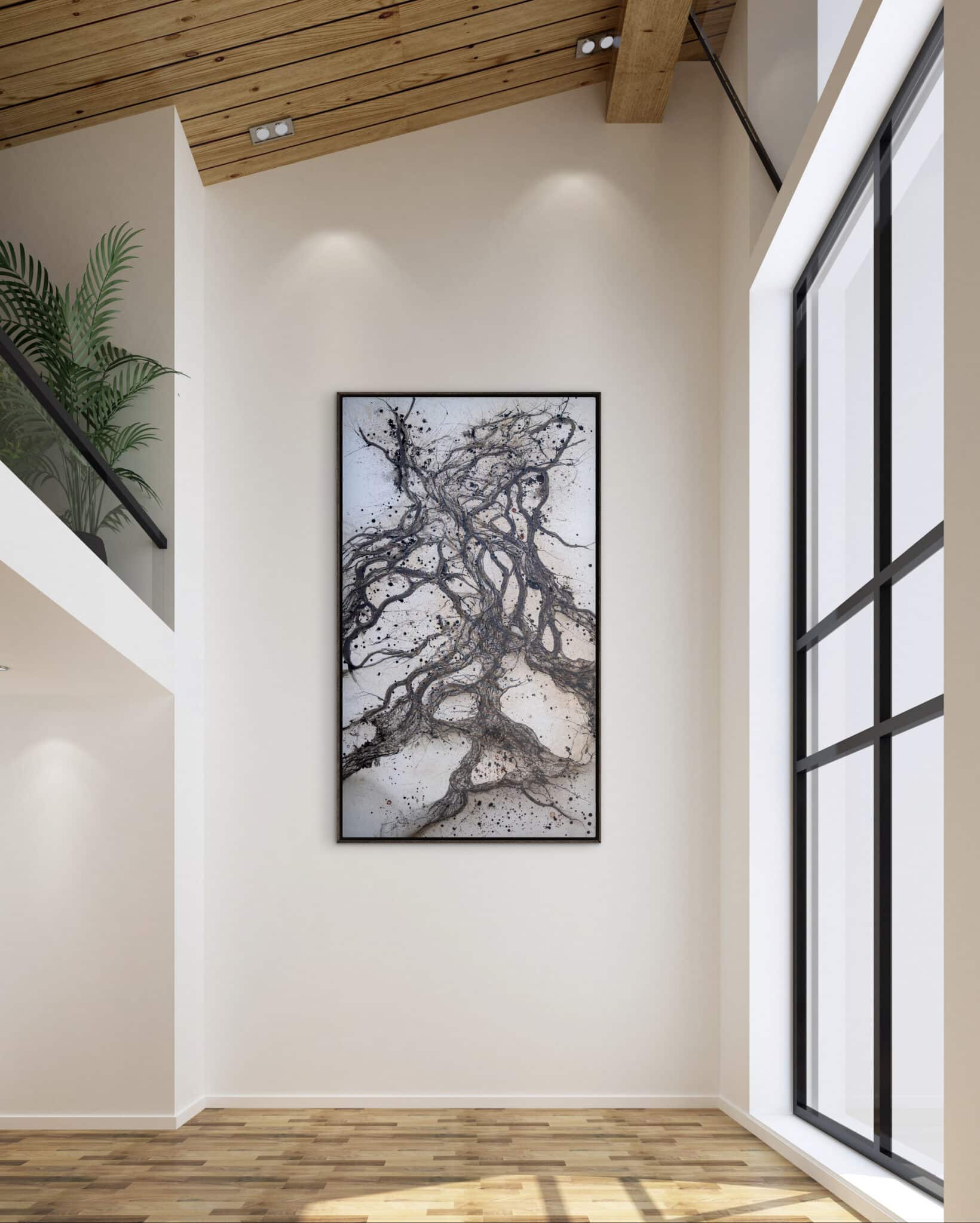EMDR IV, by Alessandra Sequeira, an evocative abstract with dynamic black and gray lines, is showcased on a tall cream wall in a luminous modern space. An original work available at MÍRAME Fine Art.