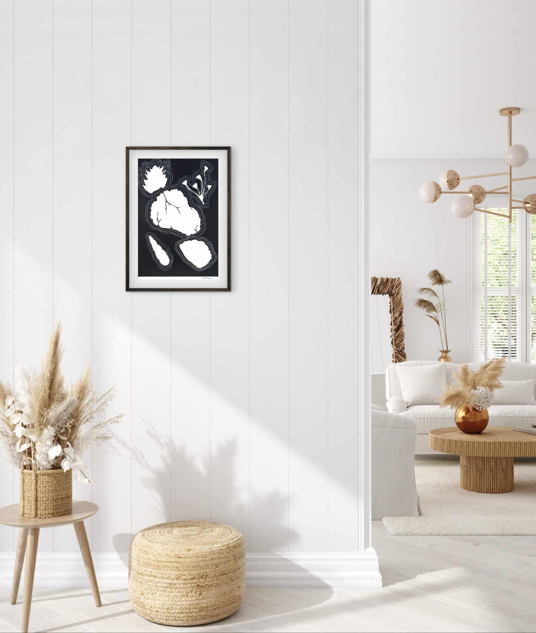 In a luminous, minimalist salon, the "El silencio tiene formas" series graces white panels amid rattan, dried grasses, and tranquil light. An original work available at MÍRAME Fine Art.